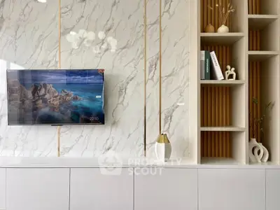 Modern living room with marble wall and built-in shelves