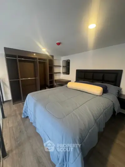 Cozy bedroom with modern design and spacious wardrobe