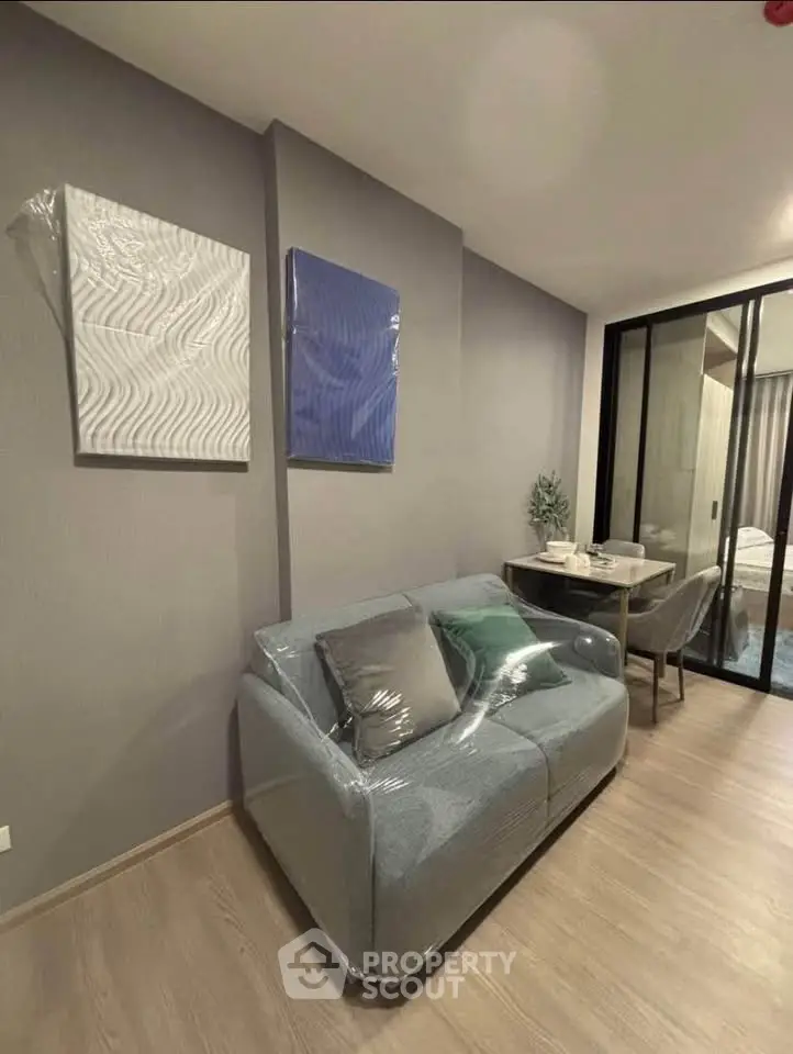 Modern living room with stylish decor and cozy seating in a contemporary apartment.