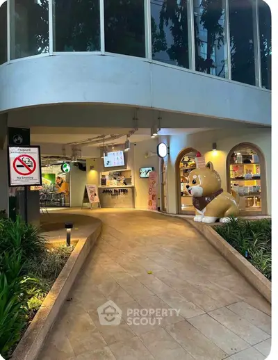 Charming commercial building entrance with unique decor and inviting walkway.