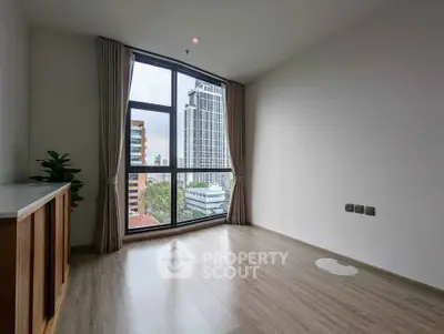 Spacious corner unit with floor-to-ceiling windows offering a stunning city view.