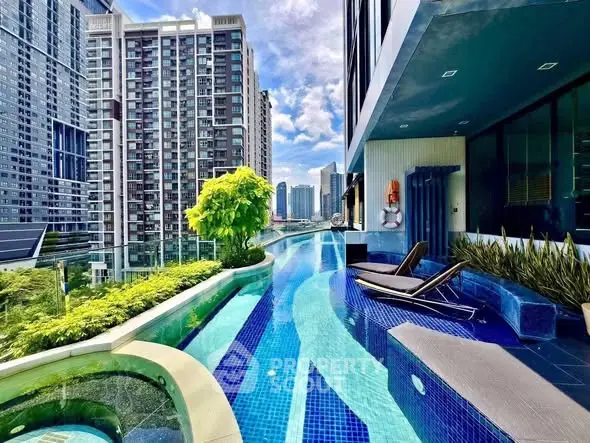 Luxurious rooftop pool with stunning city skyline view in modern high-rise building.