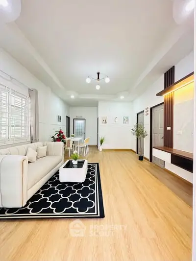 Spacious modern living room with elegant decor and wooden flooring