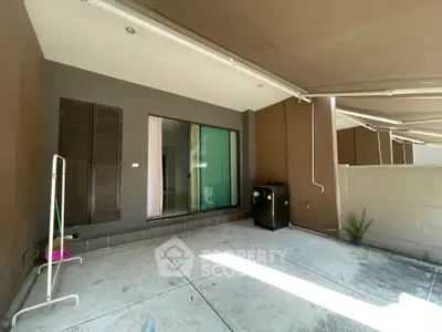 Spacious outdoor patio with modern design and ample natural light, perfect for relaxation and entertainment.