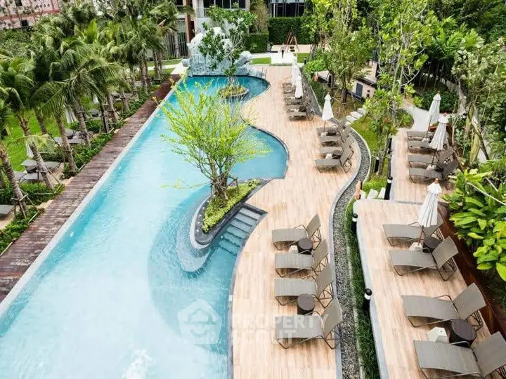 Luxurious outdoor pool area with sun loungers and lush greenery