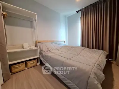 Cozy bedroom with modern decor and ample natural light