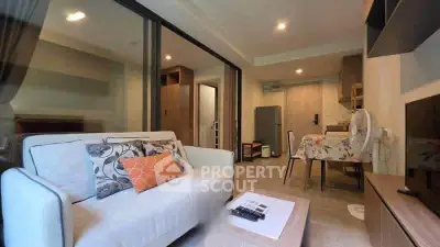 Modern living room with open kitchen layout and stylish decor