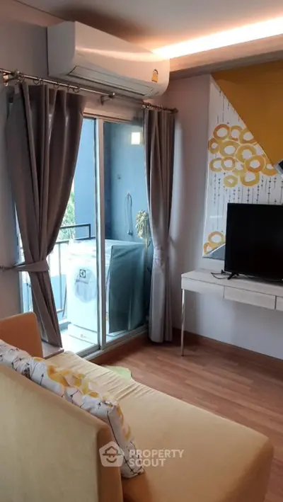Modern living room with balcony access and stylish decor