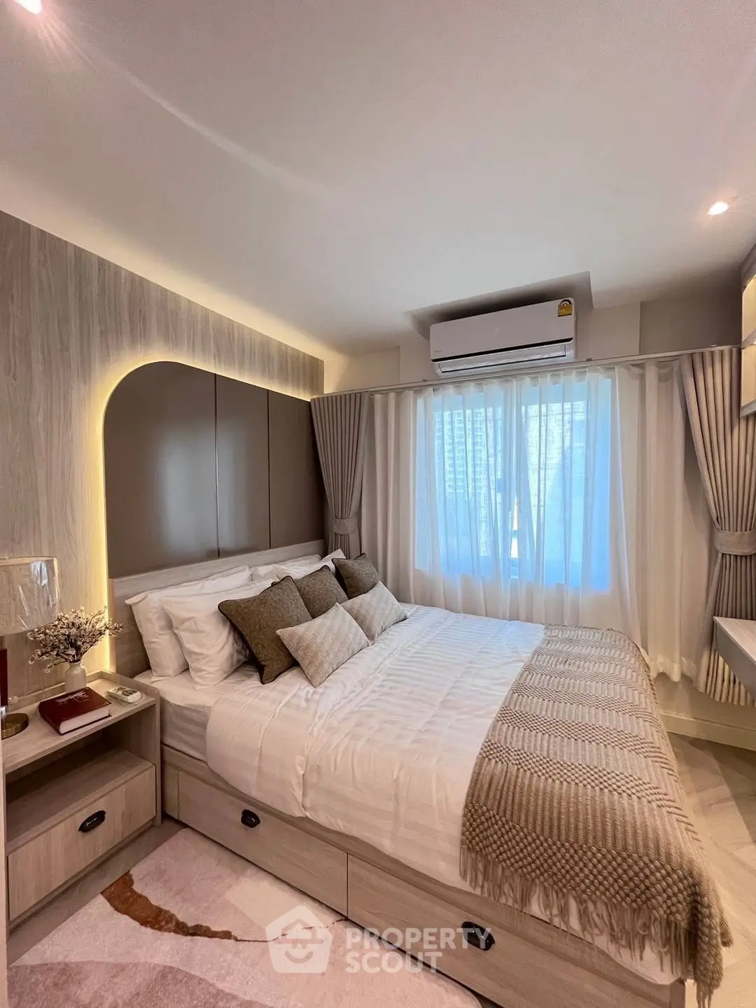 Cozy modern bedroom with stylish decor and natural light