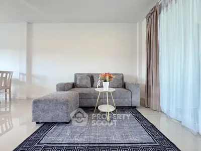 Modern living room with stylish grey sofa and elegant decor