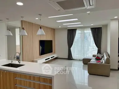 Spacious modern living room with open kitchen and stylish decor
