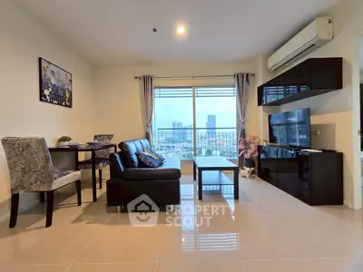 Modern living room with city view, sleek furniture, and natural light