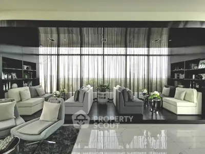 Luxurious modern living room with elegant decor and floor-to-ceiling windows