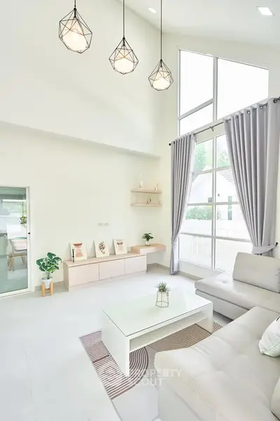 Bright and modern living room with high ceilings and elegant decor