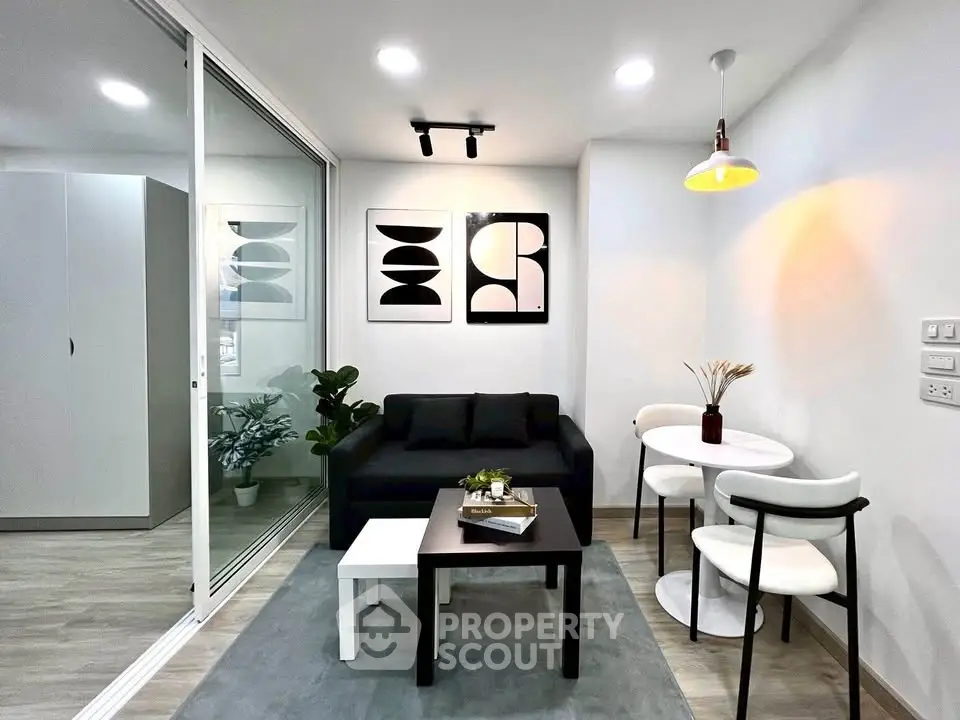 Modern living room with sleek furniture and stylish decor in a contemporary apartment.