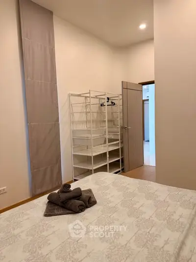 Cozy bedroom with modern decor and ample storage space