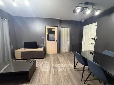 Modern living room with sleek furniture and stylish lighting in a contemporary apartment.