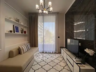 Stylish living room with modern decor, elegant lighting, and large window view.