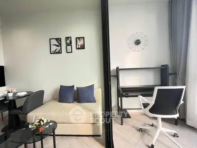Modern living room with stylish decor and study area, perfect for urban living.