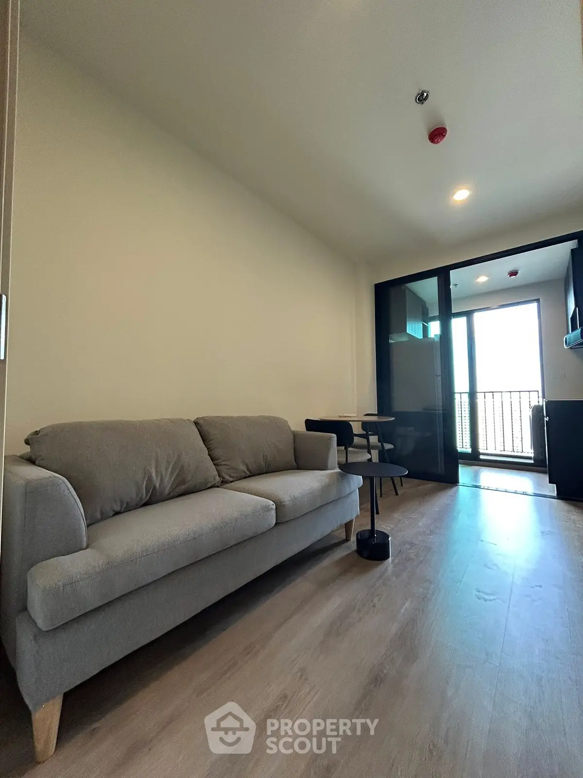 Modern living room with sleek design and balcony access