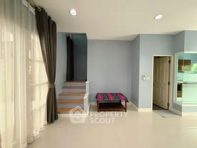 Spacious modern living area with natural light and elegant decor