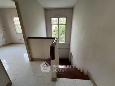 Spacious stairway with natural light in a residential property
