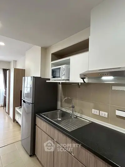 Modern kitchen with sleek cabinetry, stainless steel appliances, and ample counter space.