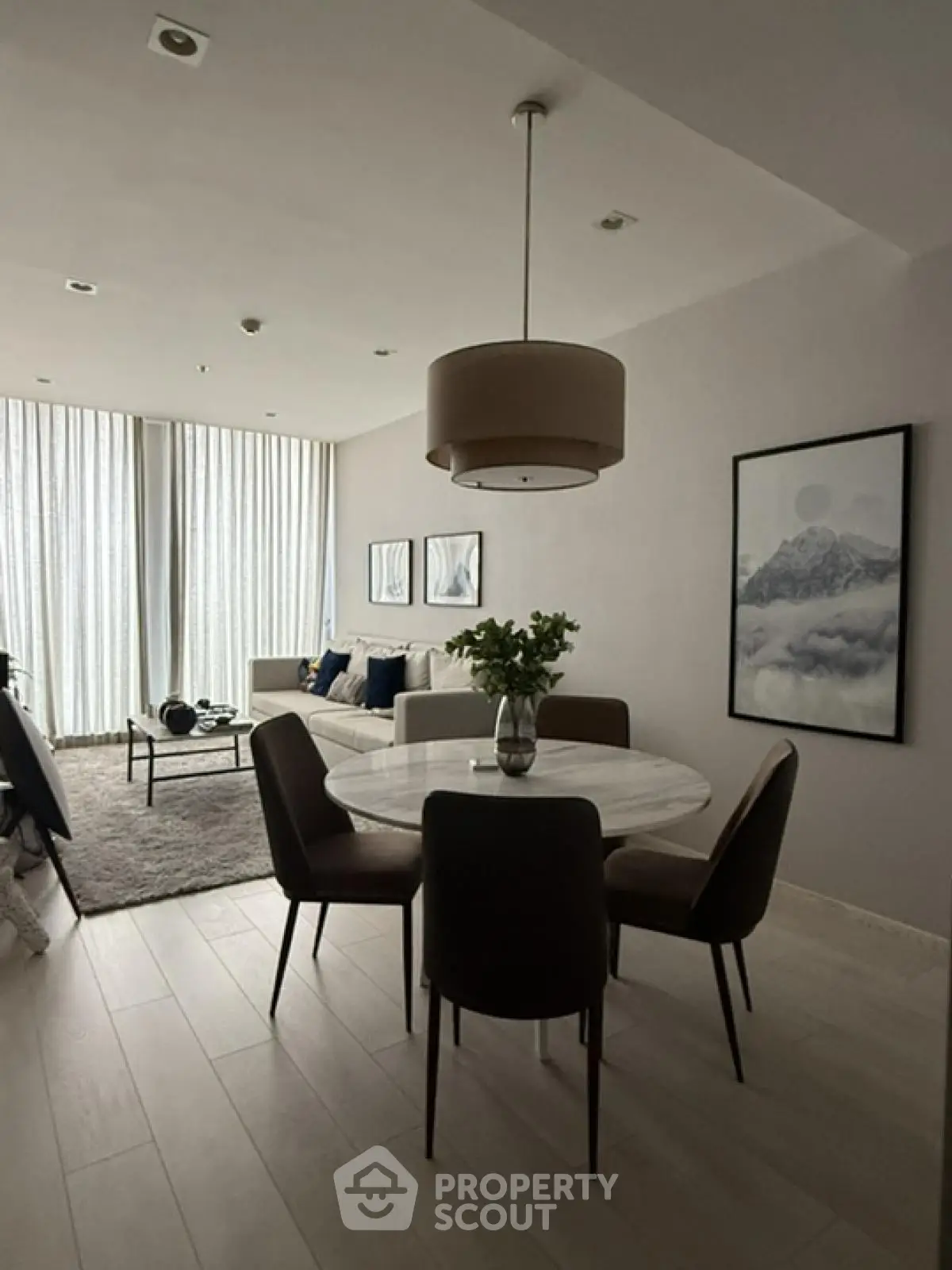 Modern living room with elegant dining area and stylish decor