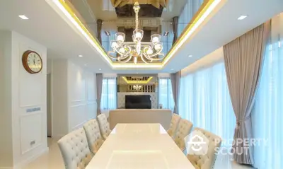 Luxurious dining room with elegant chandelier and plush seating