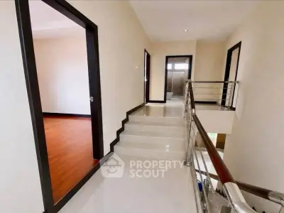 Spacious modern hallway with sleek design and wooden flooring
