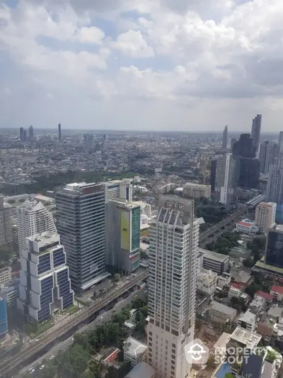 Stunning cityscape view from a high-rise building showcasing urban skyline and architecture.