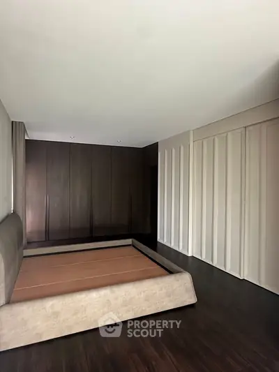 Spacious bedroom with modern design and built-in wardrobe