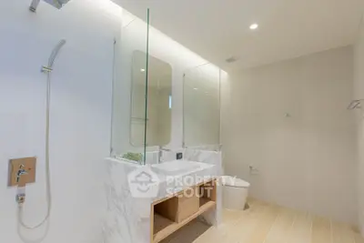 Luxurious modern bathroom with elegant marble finishes and sleek fixtures