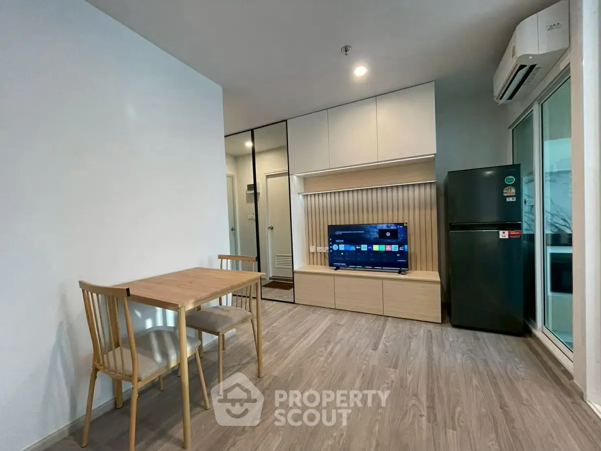 Modern living room with sleek furniture and built-in TV unit
