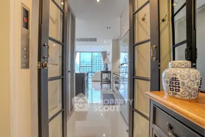 Luxurious modern apartment entrance with elegant decor and city view