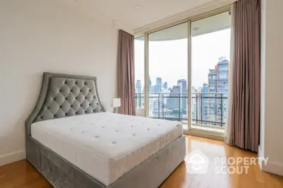 Luxurious bedroom with stunning city view and elegant furnishings