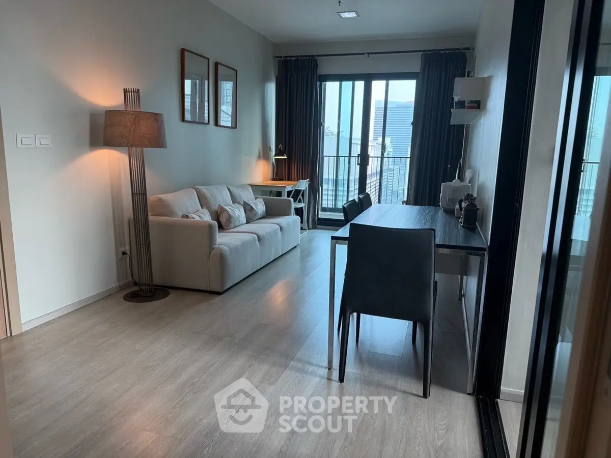 Modern living room with balcony view and stylish decor