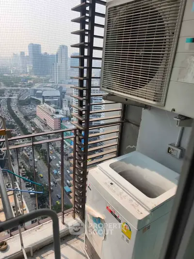 High-rise balcony with city view and washing machine, perfect for urban living.