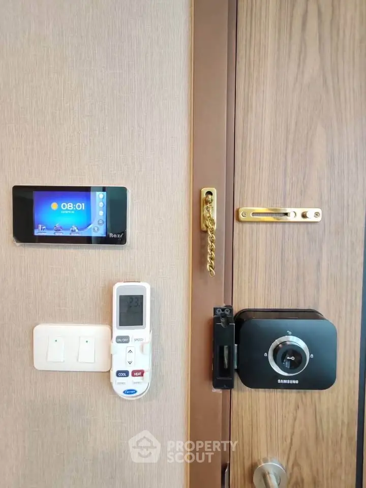 Modern apartment entrance with smart lock and control panel