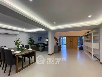 Spacious modern living room with elegant dining area and stylish decor