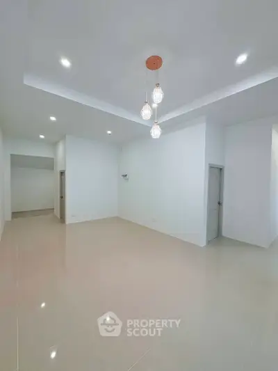 Spacious modern living room with elegant lighting and minimalist design