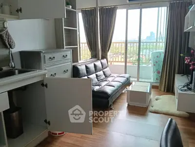 Chic living room with modern decor and stunning city view from balcony.