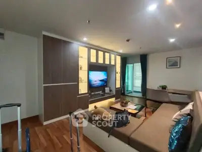 Modern living room with cozy sectional sofa and built-in entertainment center