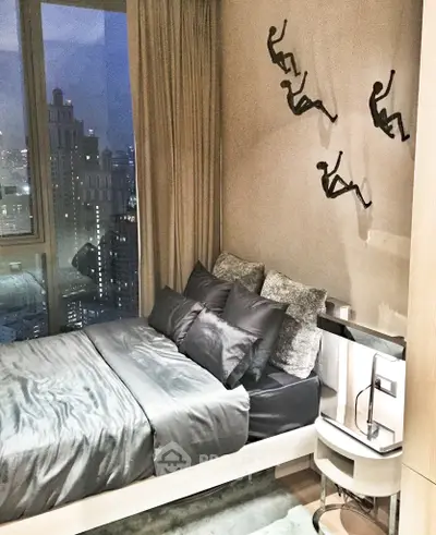 Luxurious bedroom with city view, modern decor, and artistic wall sculptures in a high-rise apartment.