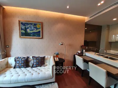 Stylish living room with modern decor and open kitchen layout