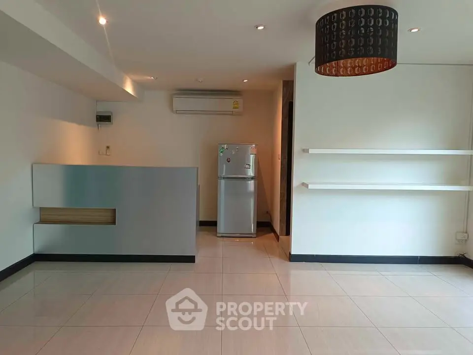 Spacious modern living room with sleek design and air conditioning