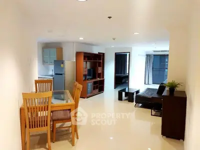 Spacious open-plan living room with dining area and modern furnishings