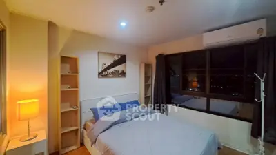 Cozy bedroom with city view, modern decor, and ambient lighting for a relaxing atmosphere.