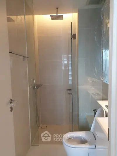 Modern bathroom with glass shower and sleek fixtures
