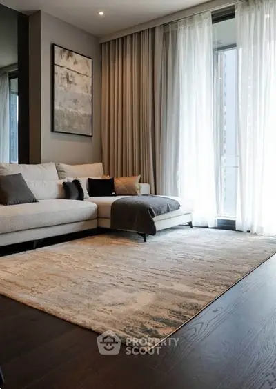 Elegant living room with modern decor and large windows for natural light.